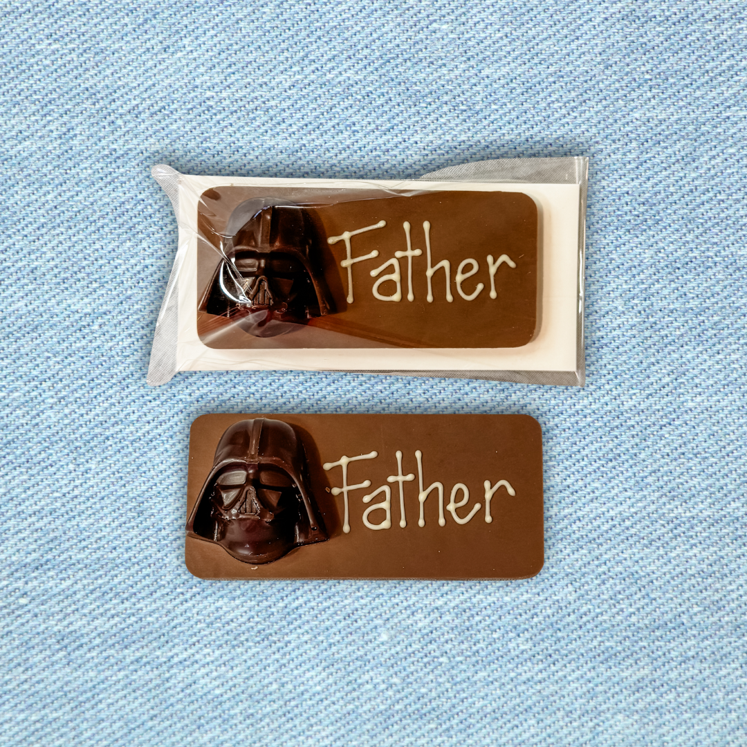 Chocolate with Darth Vader design and 'Father' text on a blue textured background